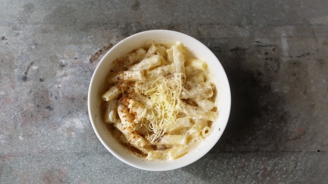 Mac and cheese ready to be served. Topped with pepper and cheese. Photo by: Student Kitchenette. 